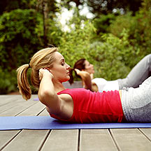 Woman doing crunches outside